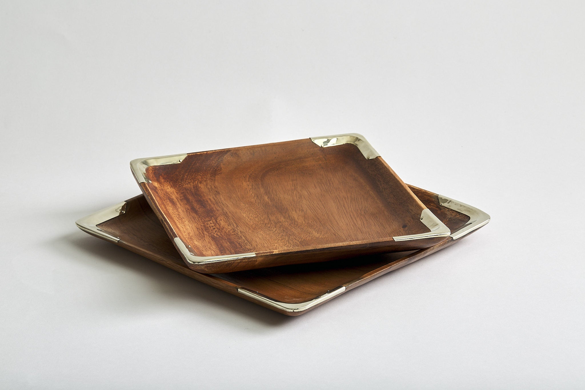Square shaped Ibera decorative trays hand-carved made of acacia wood in Argentina with curved edges accented with Alpaca silver metal trim