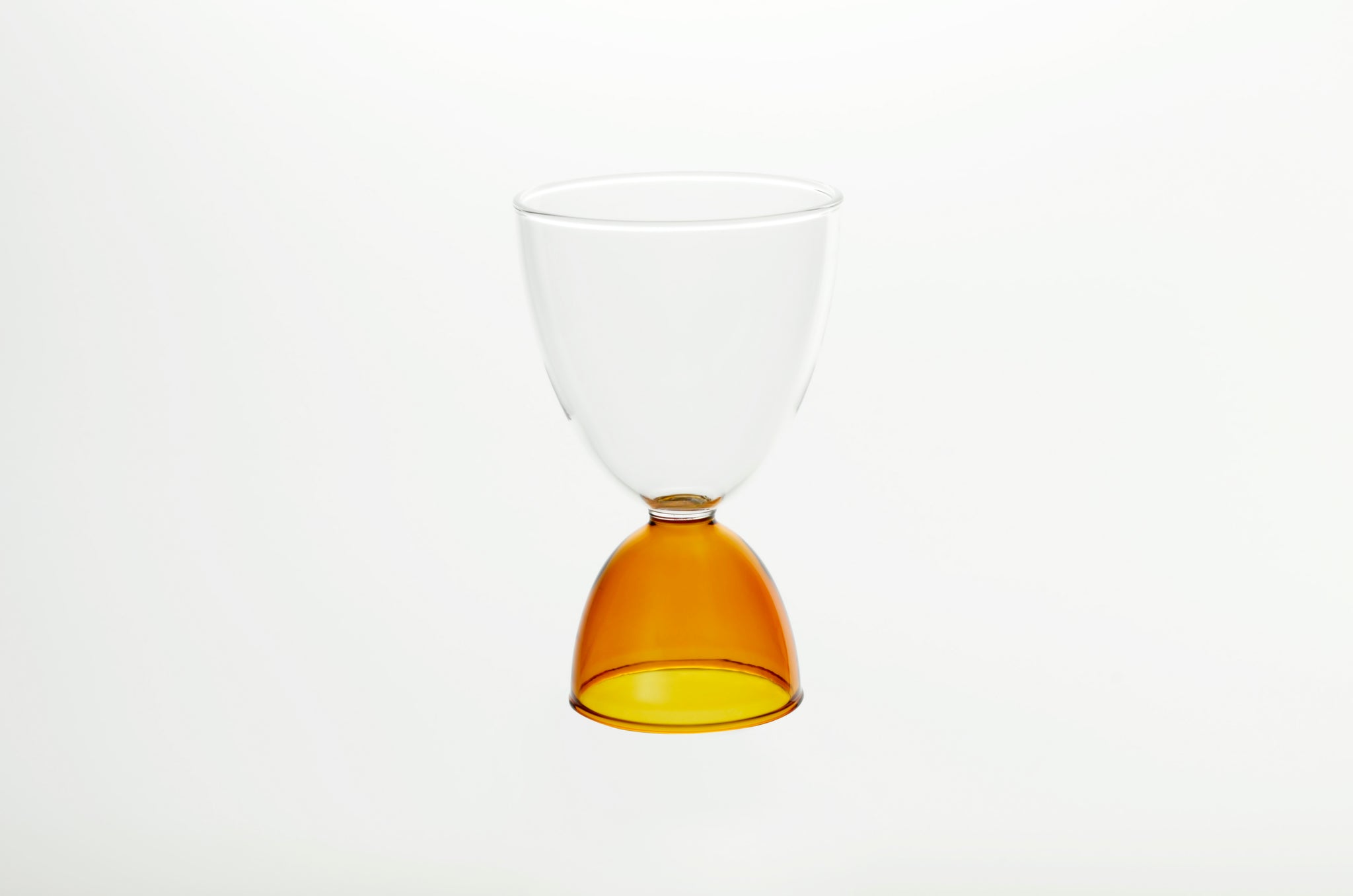 elysian collective hourglass colorful amber cocktail glass by mamo