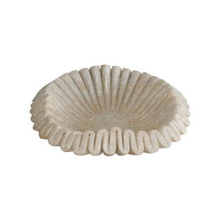 Decorative shell-like bowl with ribbed texture on a white background