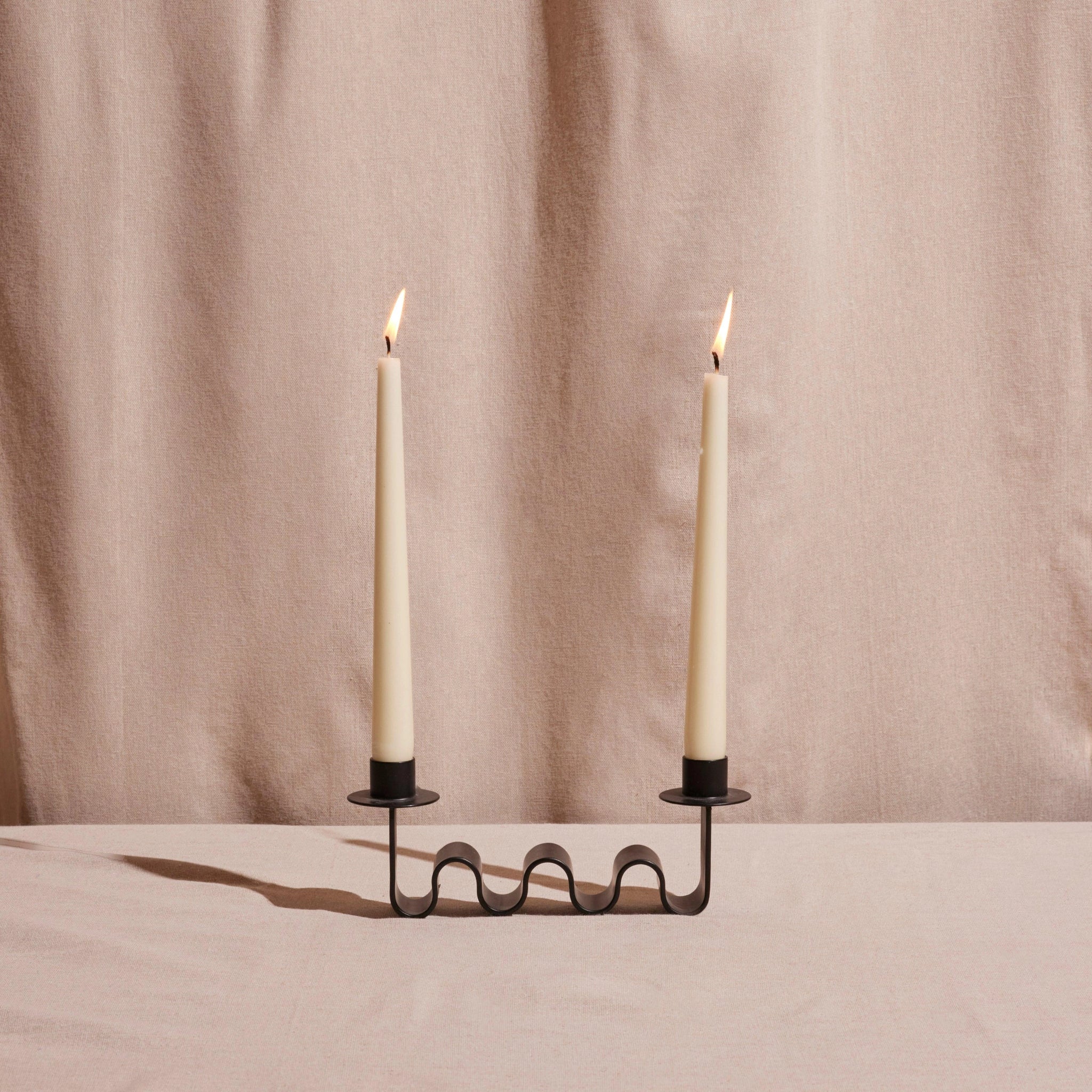 Wavy black candle holder