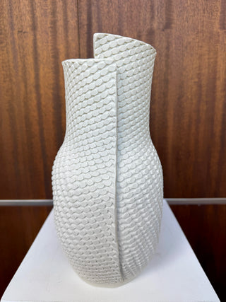 White textured vase on wood background