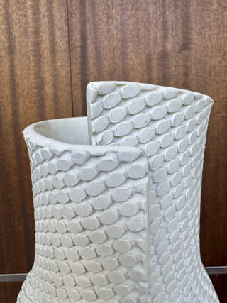 White textured vase on wood background