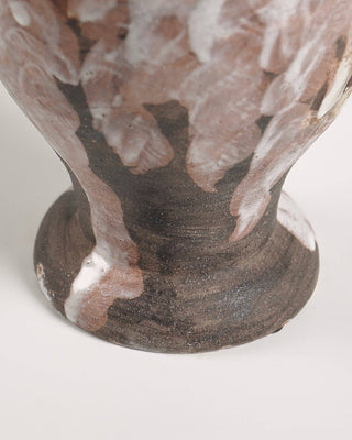 Base of ceramic vase on white background