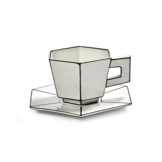 Hexagonal black and white cup and saucer on a white background