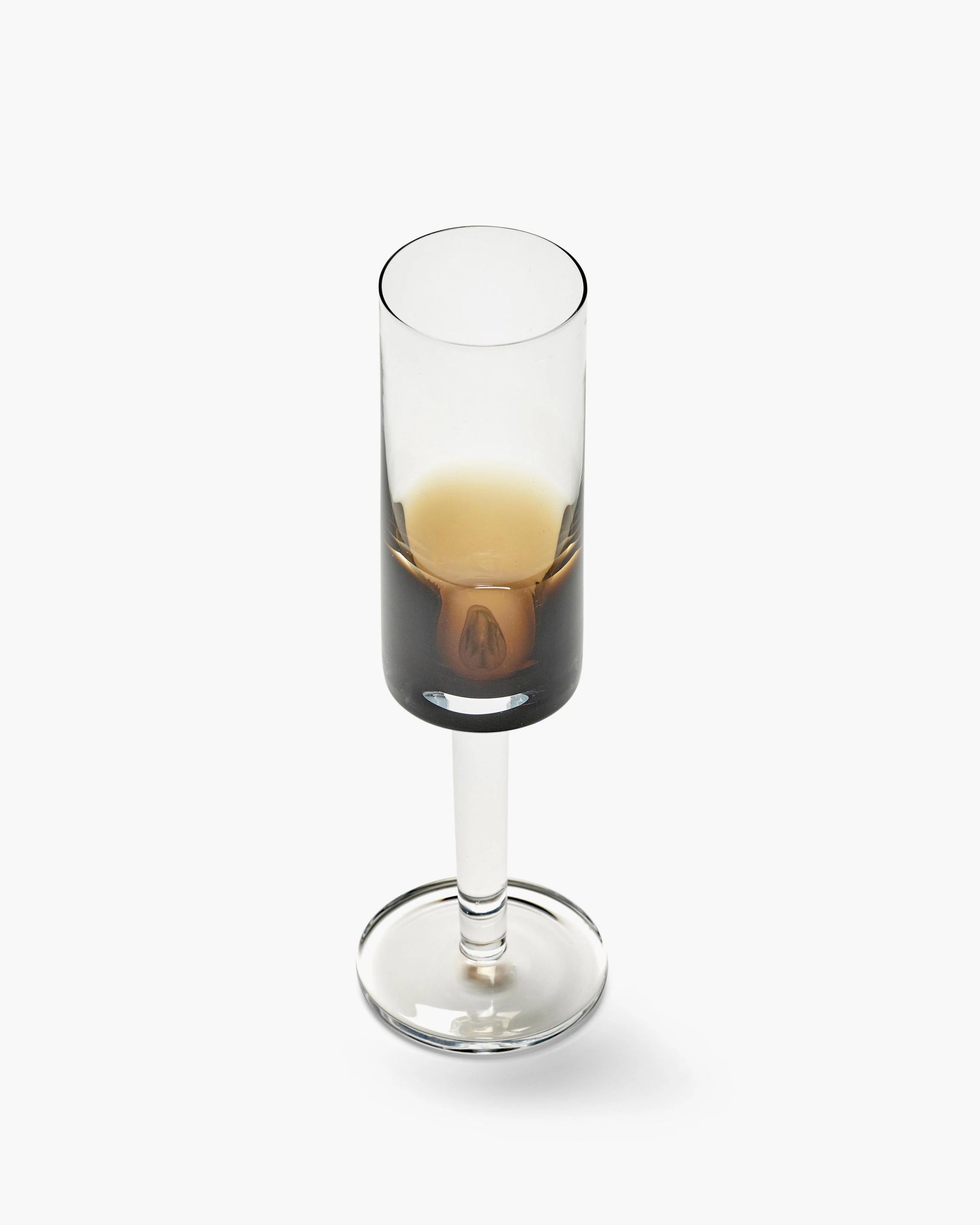 Clear champagne glass with a brown gradient color
