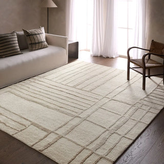 Textured beige wool rug with wavy line  in a living room
