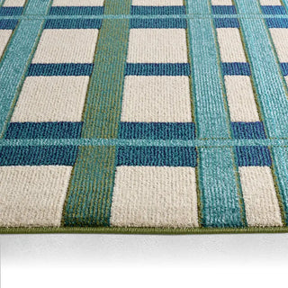 Close-up of a checkered patterned rug with blue and beige squares.