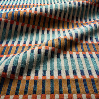 Multicolored striped fabric with a pattern of blue, orange, and white lines.