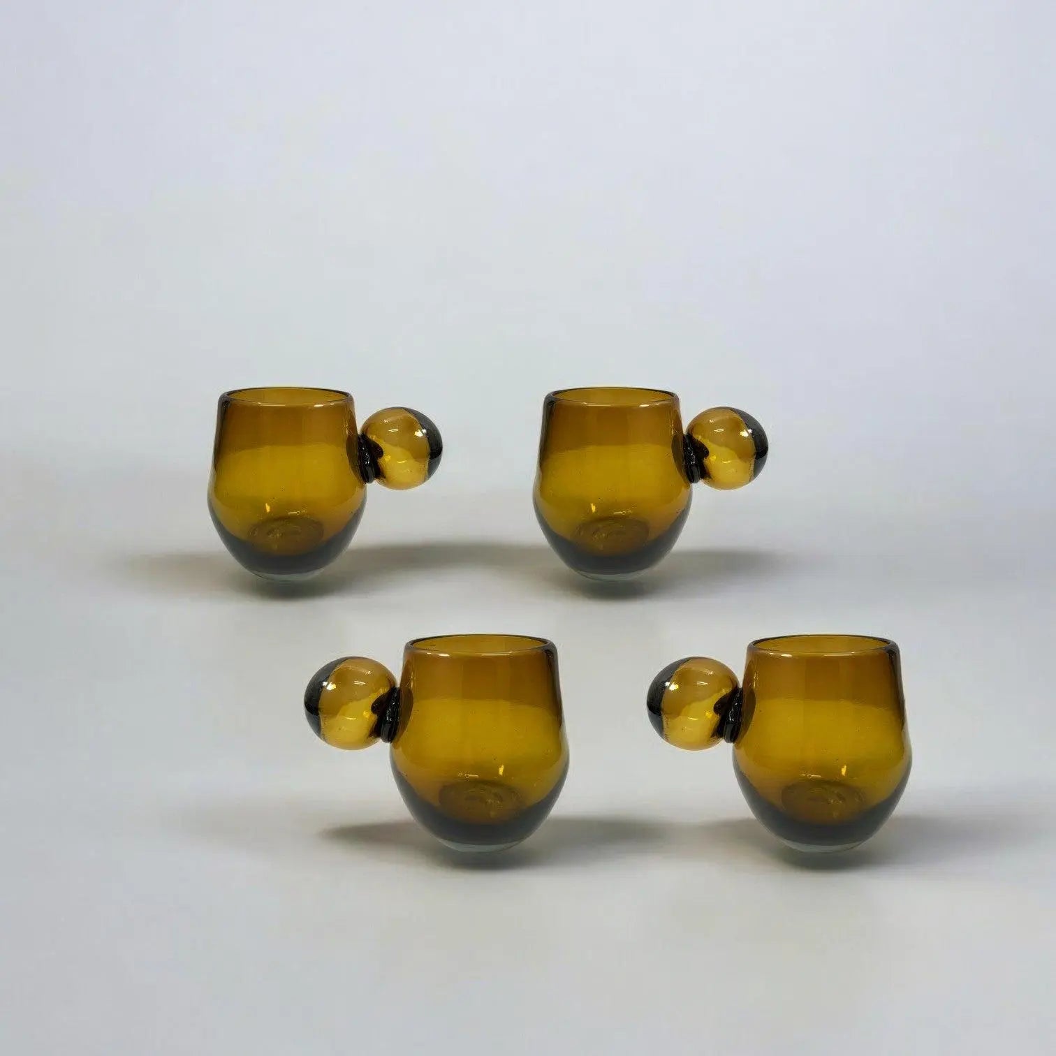 Set of four amber glass tumblers 