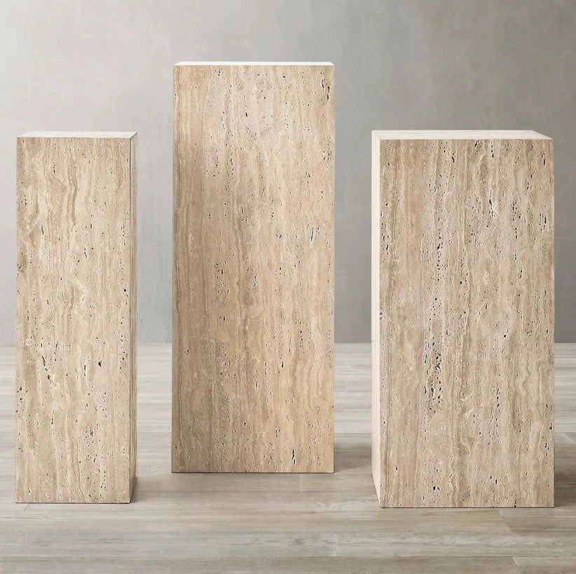 Three stone pedestals of different sizes 