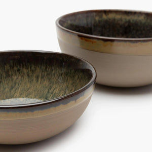 Two ceramic bowls with a rustic finish 