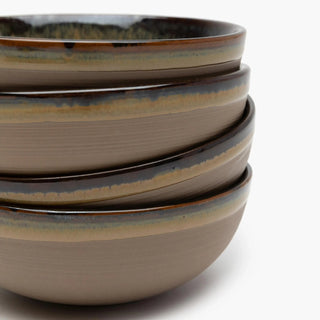 Stack of ceramic bowls with a speckled pattern