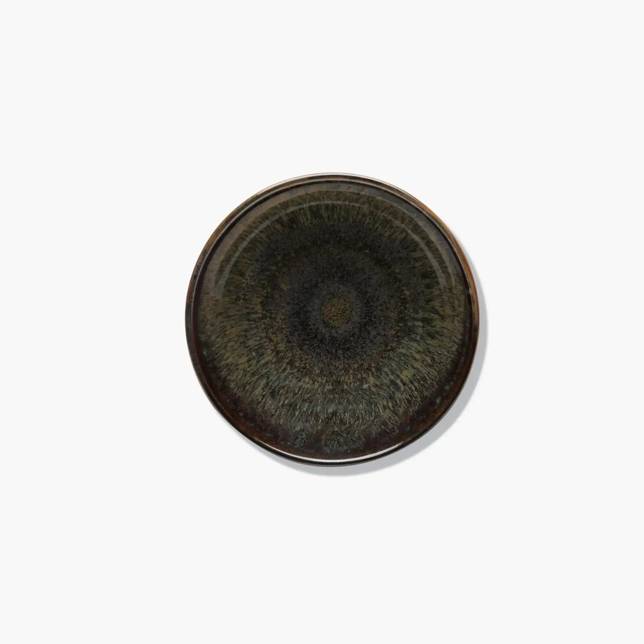 Round ceramic dish with a textured surface