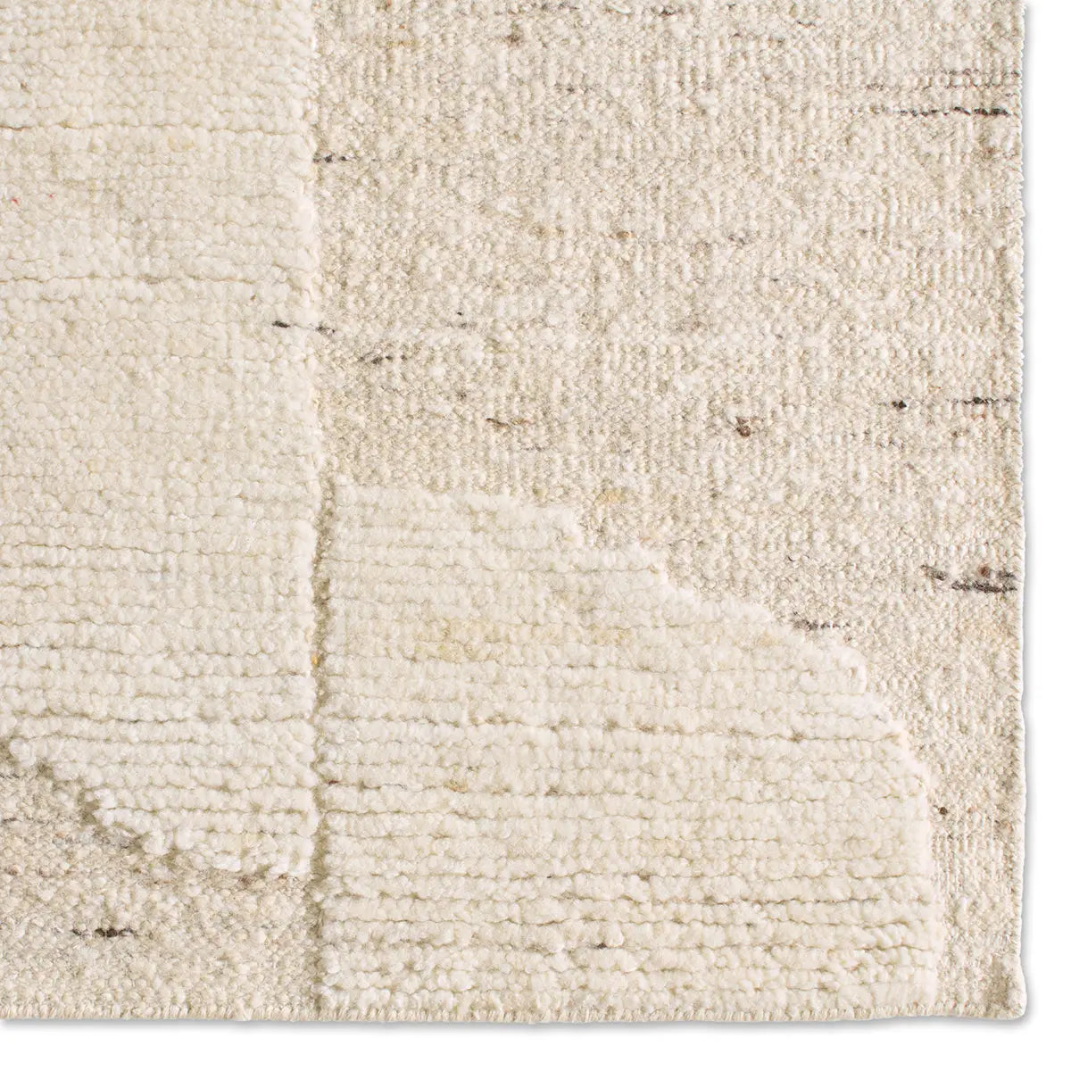 Close-up of a textured beige rug 