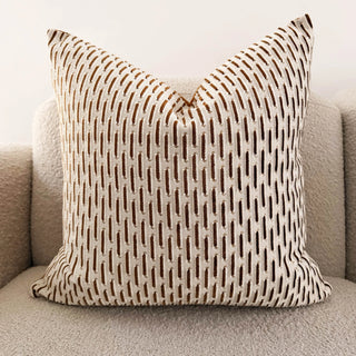 pattern throw pillow on white sofa 