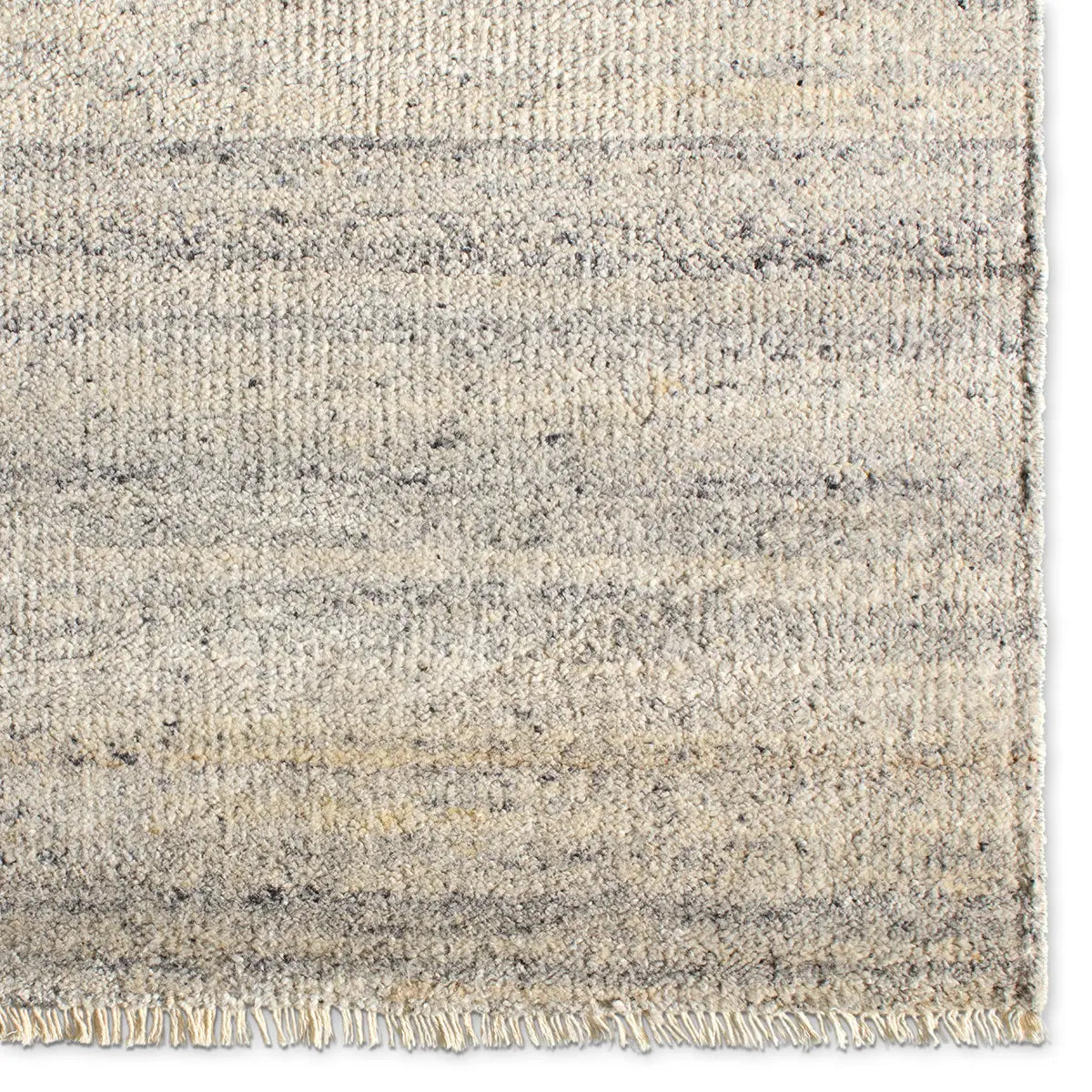 Textured area rug with a gradient grey pattern 