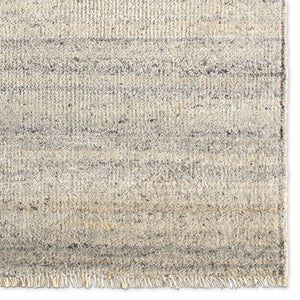 Textured area rug with a gradient grey pattern 