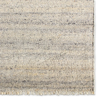 Textured area rug with a gradient grey pattern 