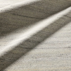 Textured area rug with a gradient grey pattern 
