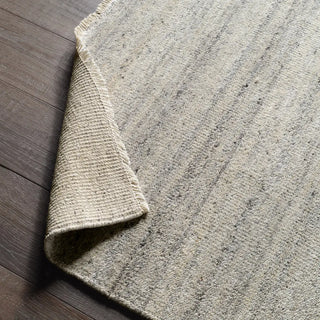 Textured area rug with a gradient grey pattern 