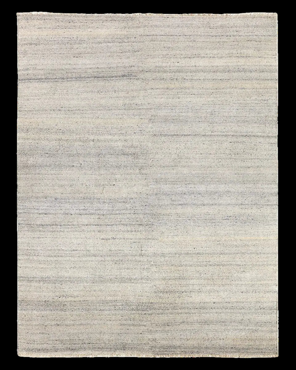 Textured area rug with a gradient grey pattern 