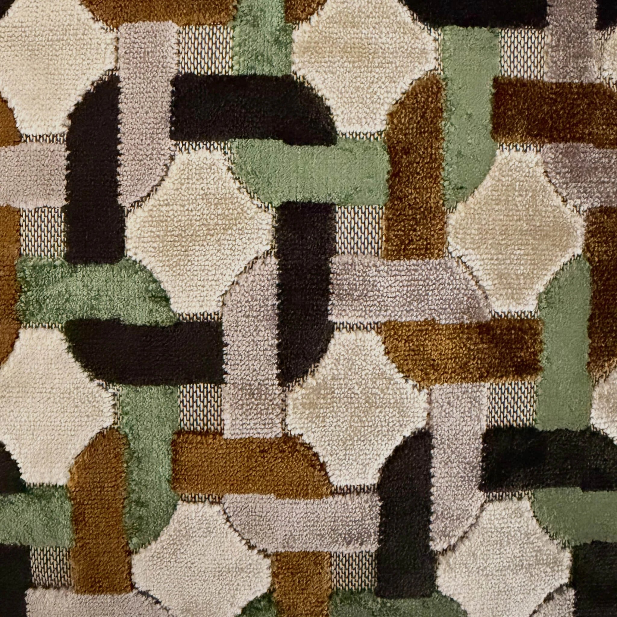 Close-up of a pattern fabric with shades of green, brown, and brown.
