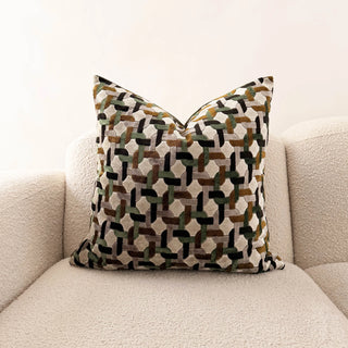 geometric velvet throw pillow on white sofa 