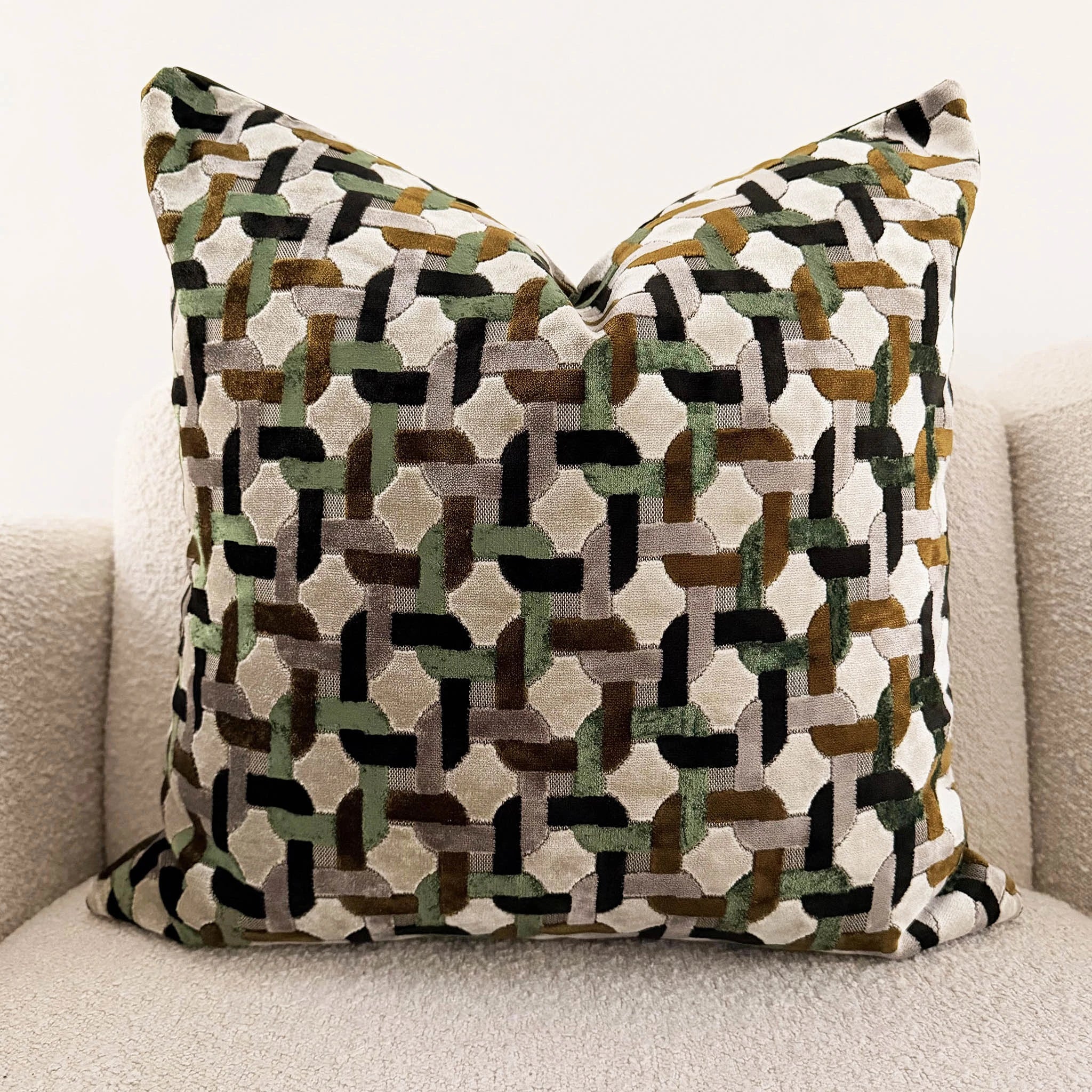 Decorative pillow with geometric pattern on a neutral background