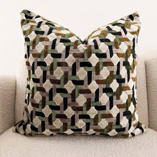 Decorative pillow with geometric pattern on a neutral background