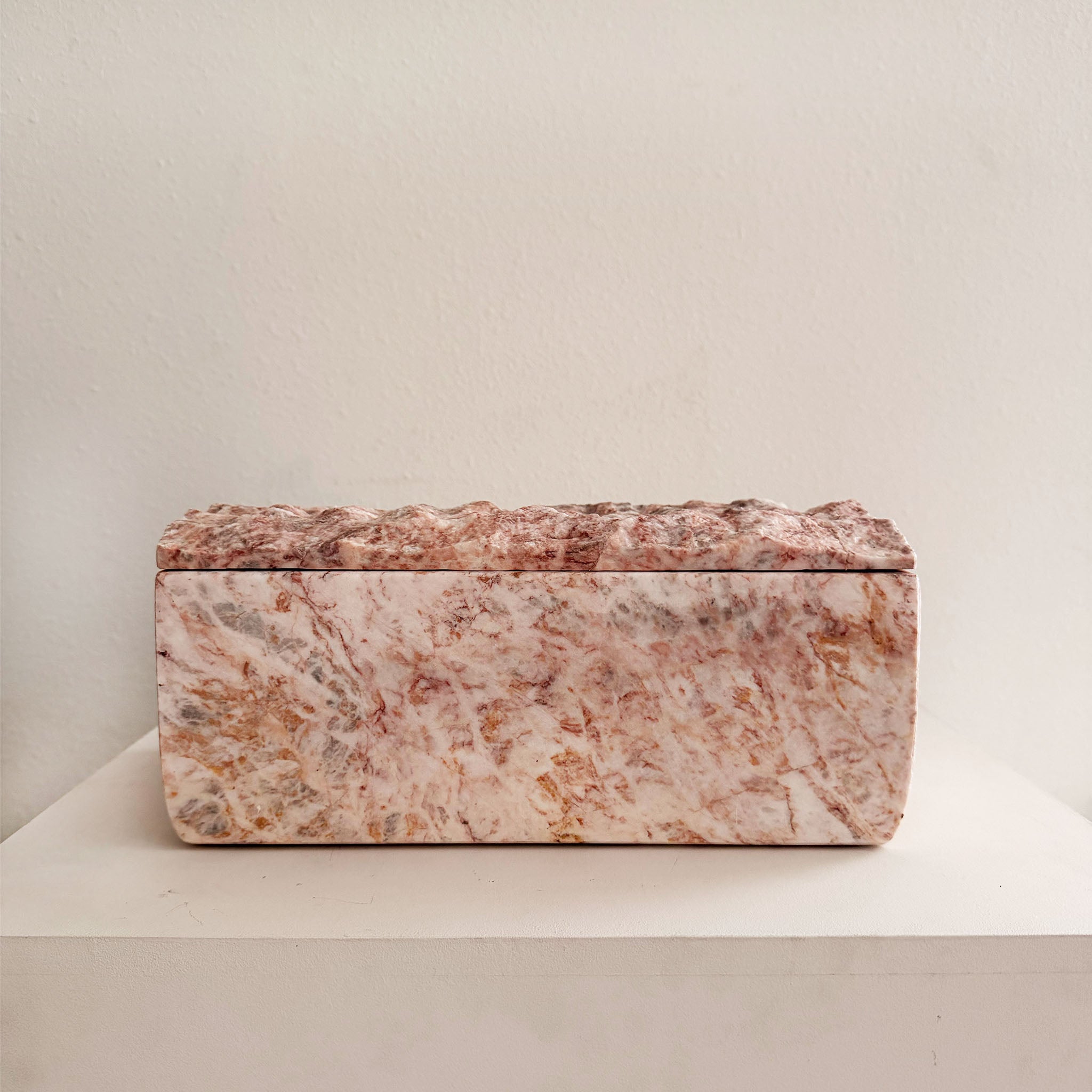 Marble-patterned rectangular box on a light background