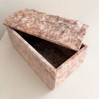 Marble-patterned box on a light background