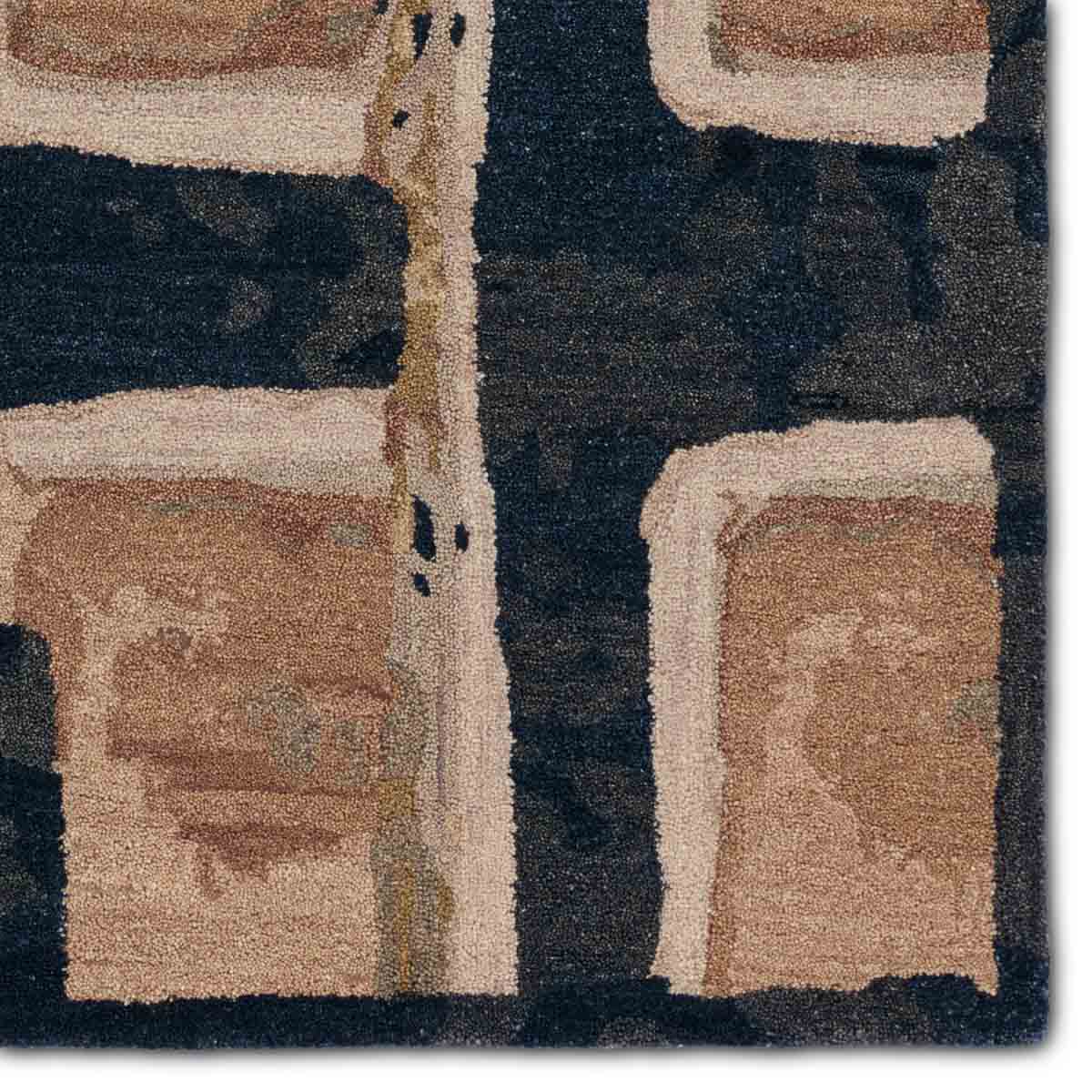 Rectangular rug with geometric pattern in brown, black, peach and beige