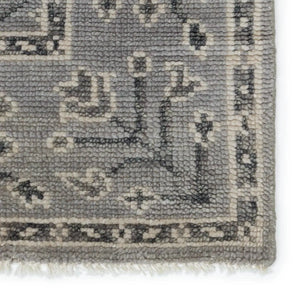 Close-up of a textured gray rug with intricate patterns 