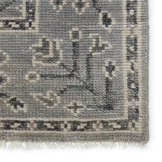 Close-up of a textured gray rug with intricate patterns 