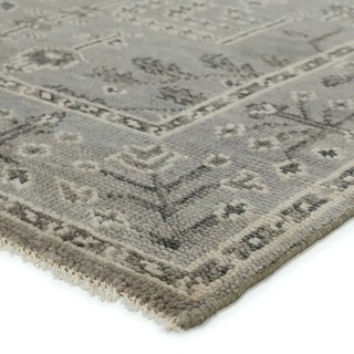 Close-up of a textured gray rug with geometric pattern 