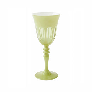 Green glass goblet on a white background