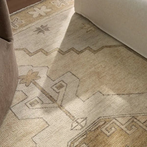 Beige area rug with geometric pattern 
