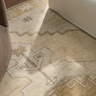 Beige area rug with geometric pattern 