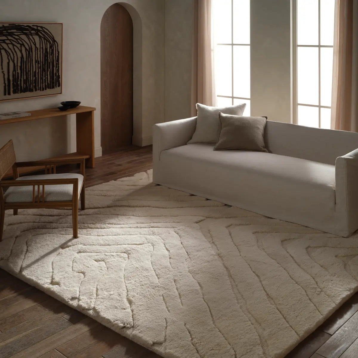 Beige textured area rug with wavy pattern 