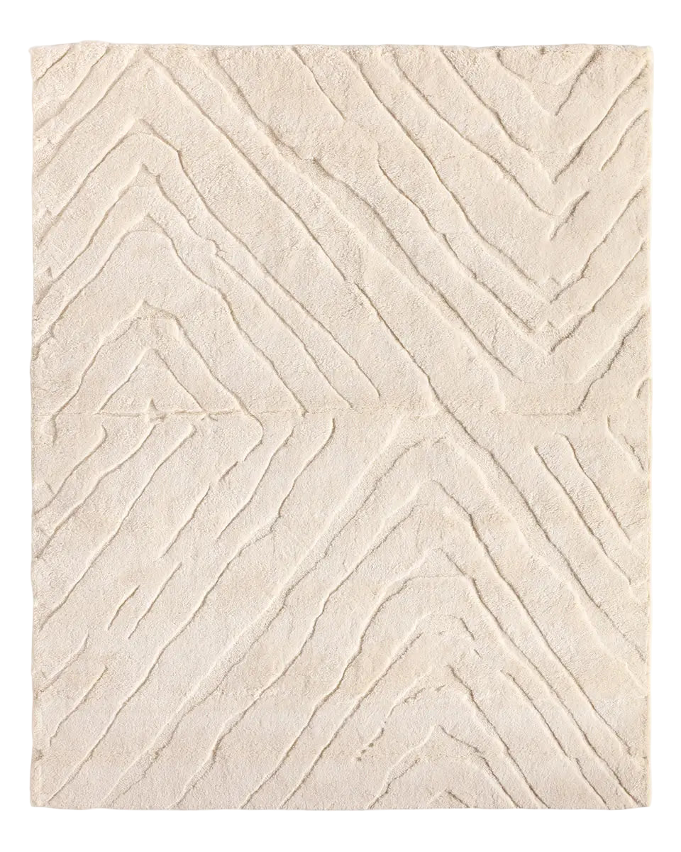 Beige textured area rug with wavy pattern 
