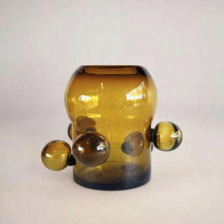 Yellow glass vase with spherical design made in Mexico