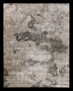 Textured area rug with abstract pattern 