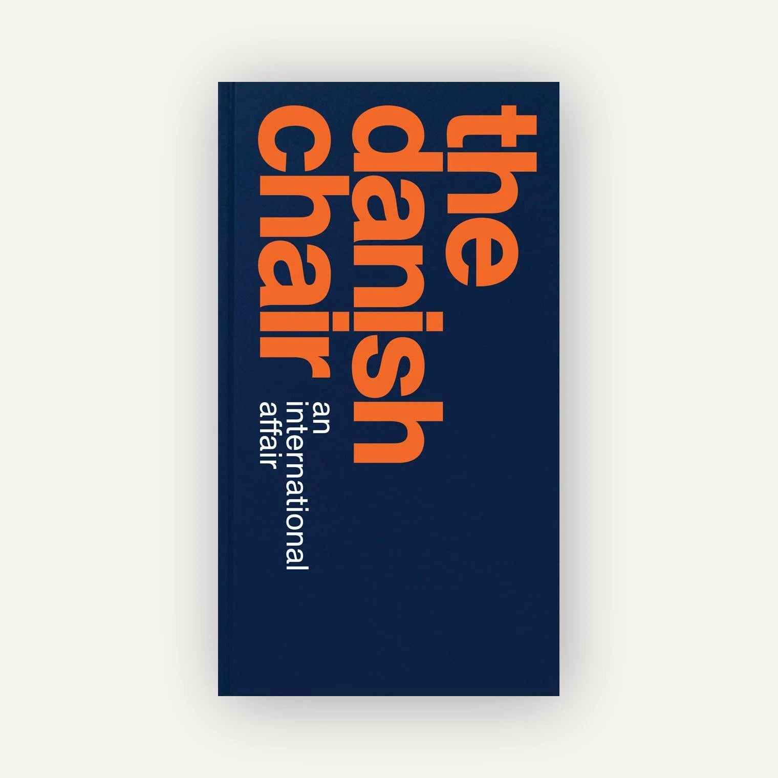 Book cover with 'The Danish Chair' text on a blue background