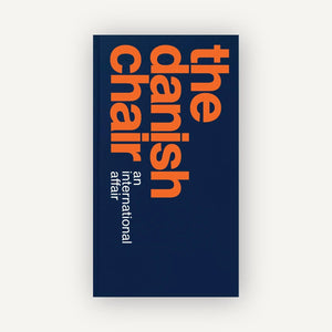 Book cover with 'The Danish Chair' text on a blue background