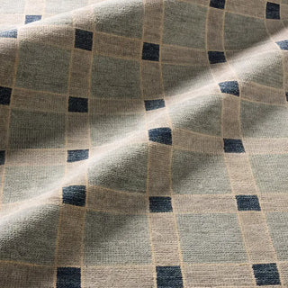 Checkered fabric with a pattern of blue and beige squares.