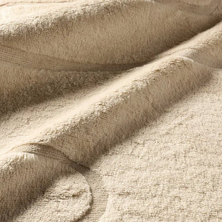 Close-up of beige textured wool rug