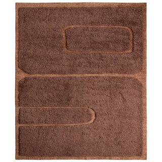 Rust colored wool rug with geometric pattern
