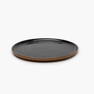Round ceramic plate with a brown rim 