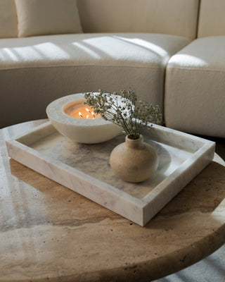 White marble tray on a coffee table.