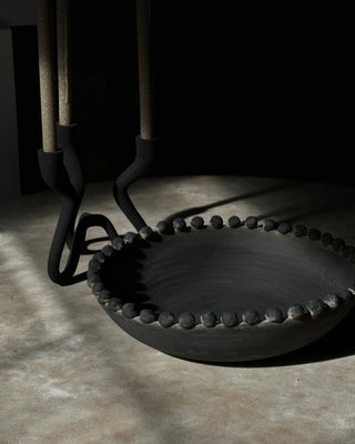 Ceramic bowl on a stone surface.